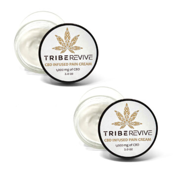 Two open jars of TribeTokes TribeRevive CBD Pain Cream on a white background, each showing the whipped cream and labeled 1,000 mg of CBD and 2.0 oz