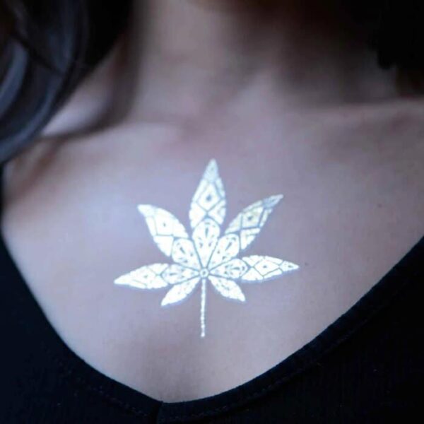 Metallic tattoo displayed on chest