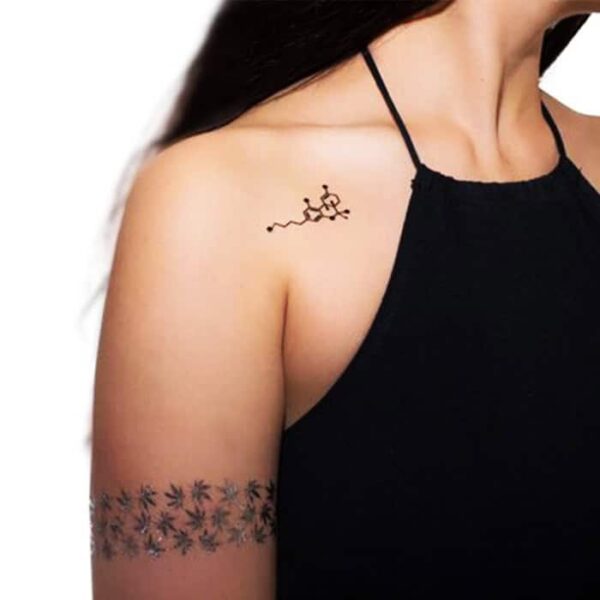 Metallic tattoo displayed on hand and shoulder