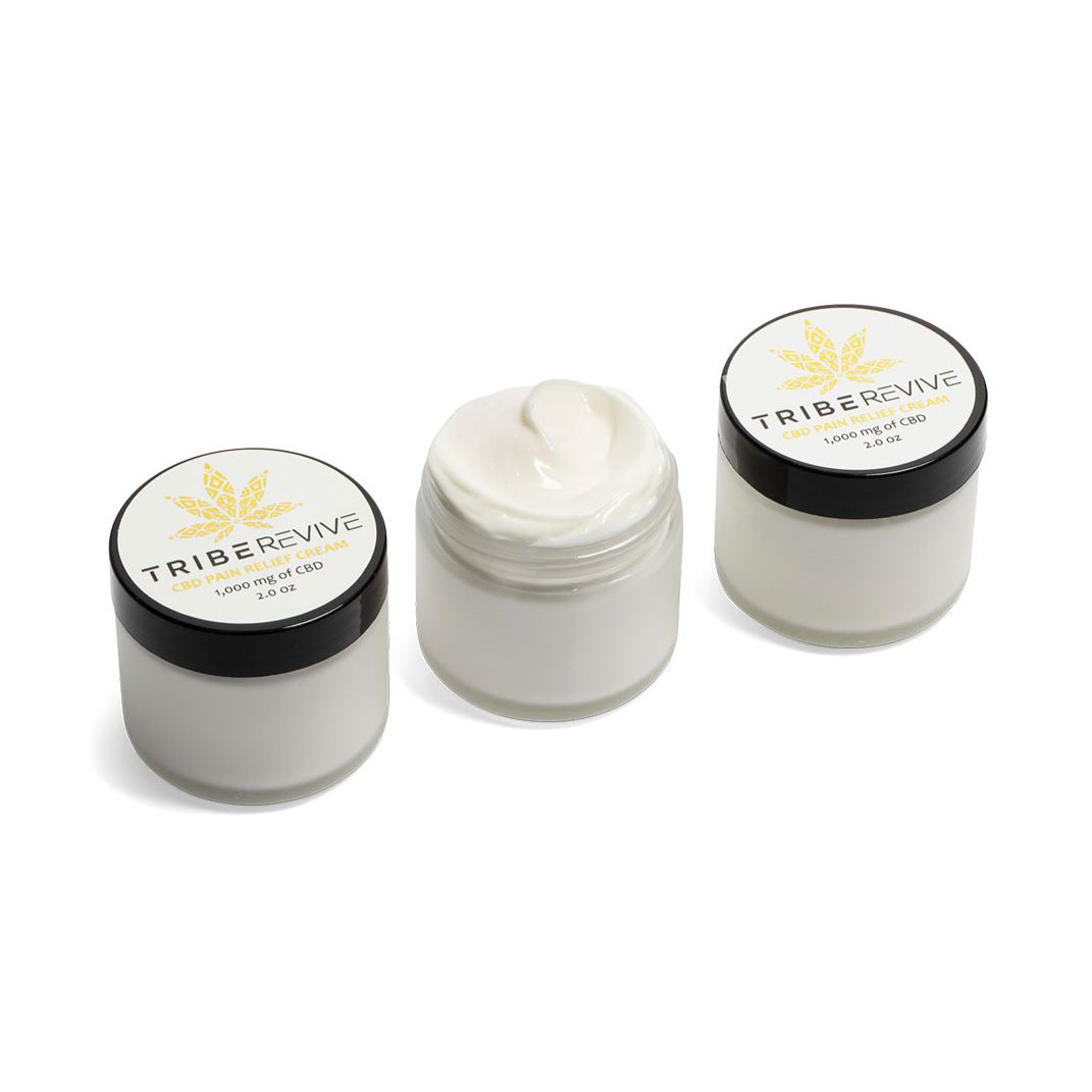 Three jars of TribeTokes TribeRevive Pain Relief Cream on a white background, the center jar open to show the whipped cream, each labeled 1,000 mg and 2.0 oz
