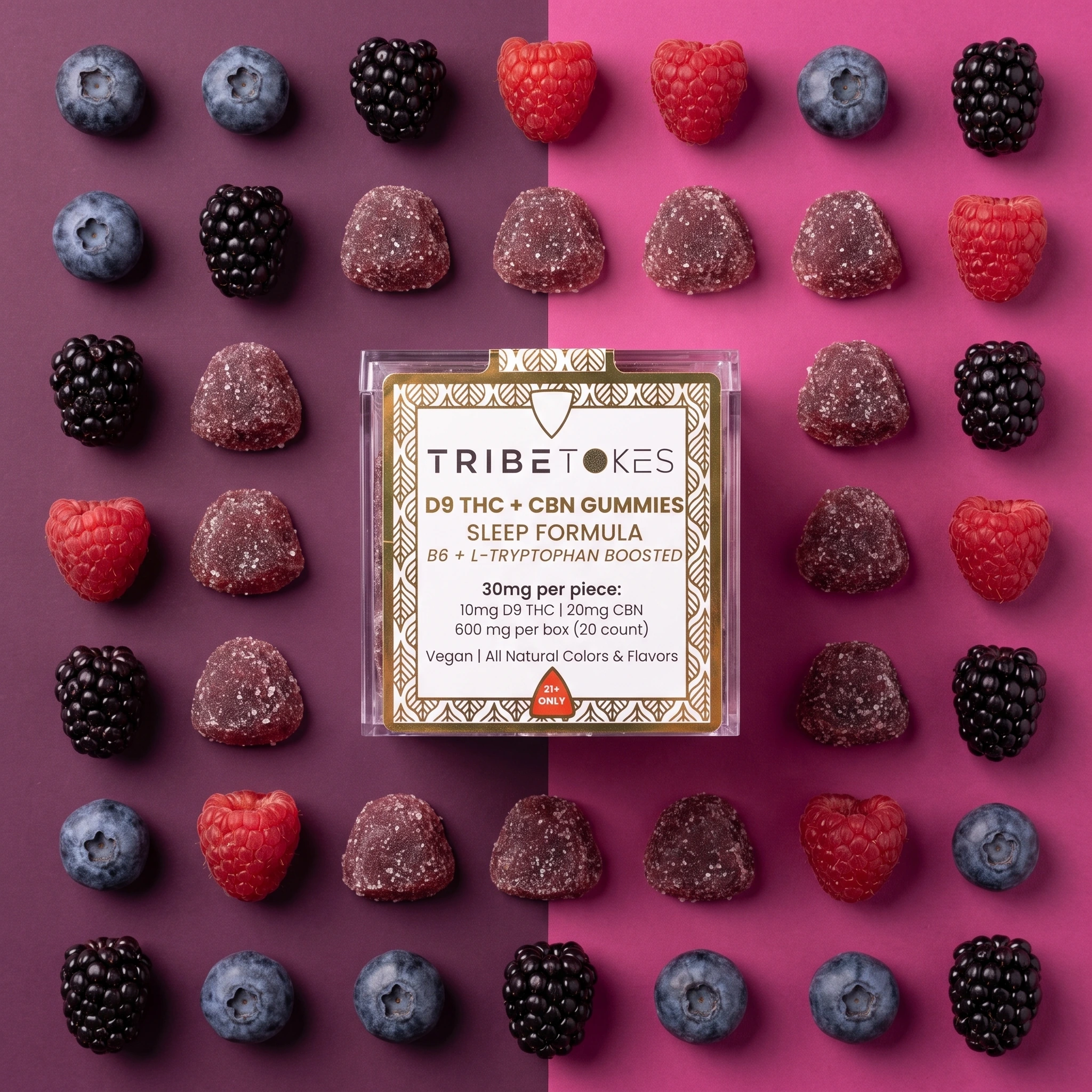 Overhead flatlay of a TribeTokes Sleep Mixed Berry gummies box centered on a purple and magenta color-block background, framed by a grid of fresh blackberries, blueberries, raspberries, and sugar-coated gummies