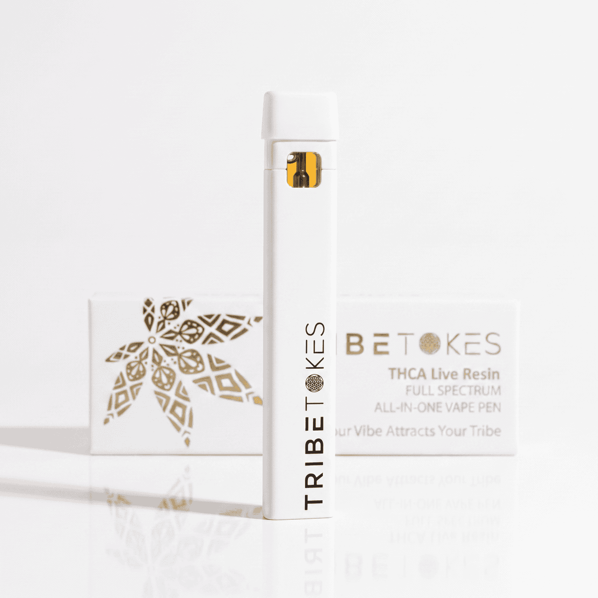 TribeTokes THCa Live Resin all-in-one disposable vape pen standing in front of its white and gold box on a white background