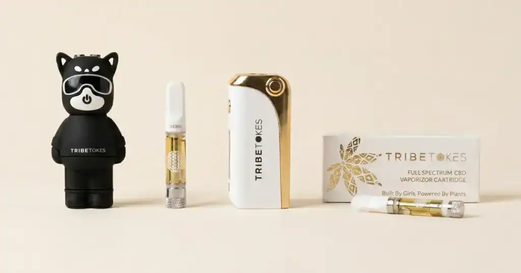TribeTokes cannabis vape product lineup featuring the Vape Kitty battery, Saber premium vape battery with cartridge, and a TribeTokes vape cartridge on a cream background — complete guide to cannabis vapes, cartridges, and batteries
