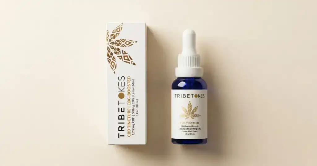 TribeTokes CBD Tincture bottle and box with gold mandala label on a cream background — full spectrum vs broad spectrum vs isolate CBD guide