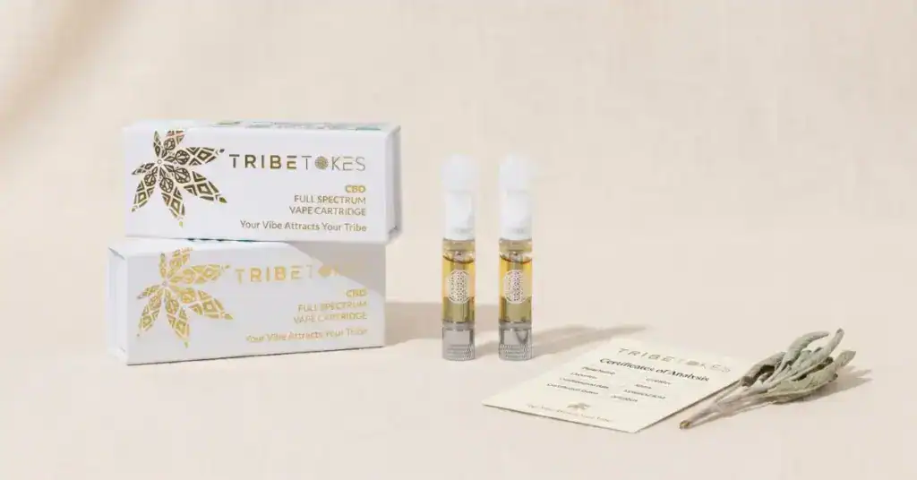 TribeTokes CBD vape cartridges 2-pack on cream surface — CBD drug test guidance and COA transparency