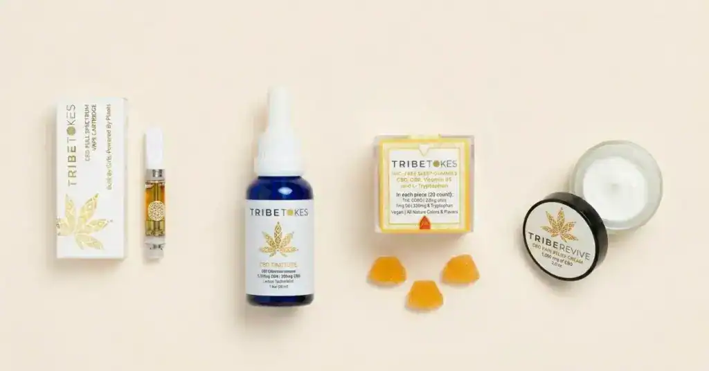 TribeTokes CBD products including a vape cartridge and tincture representing the full-spectrum hemp-derived CBD lineup