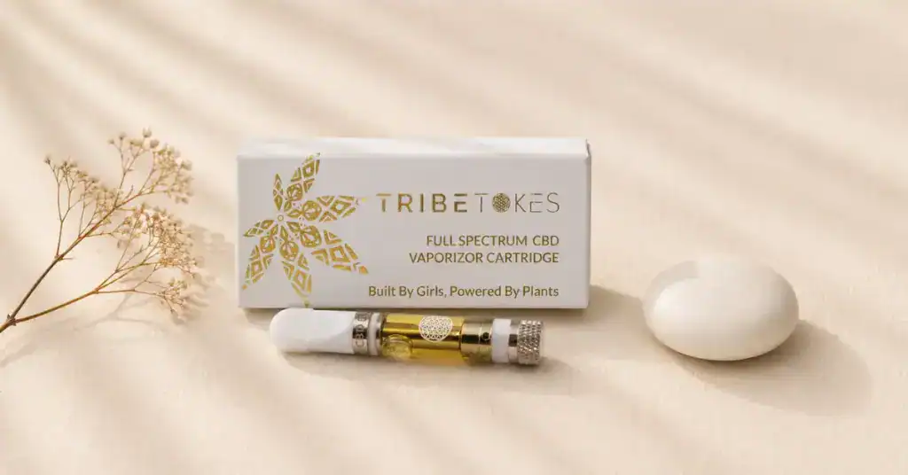 TribeTokes Full Spectrum CBD vape cartridge and box on cream linen — clean product flatlay representing third-party tested, additive-free vape safety standards in the context of the 2019 EVALI crisis
