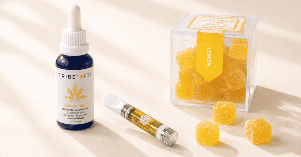 TribeTokes CBG tincture vape cartridge and gummy box arranged together on a cream background representing the best cannabis products for daytime focus energy and clarity