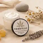 TribeRevive CBD pain cream and CBD Live Resin Gummies with lavender and chamomile botanicals on a cream background representing CBD products researched for migraine relief and prevention