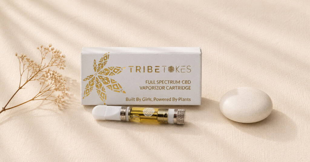 TribeTokes Full Spectrum CBD vape cartridge and box on cream linen — clean product flatlay representing third-party tested, additive-free vape safety standards in the context of the 2019 EVALI crisis