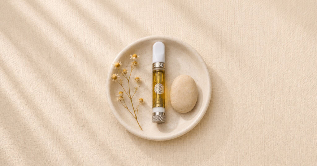 TribeTokes 1:1 CBD Delta-8 vape cart on cream background with soft botanicals — approachable flatlay for first-time cannabis user guide on dosing, setting and what to expect