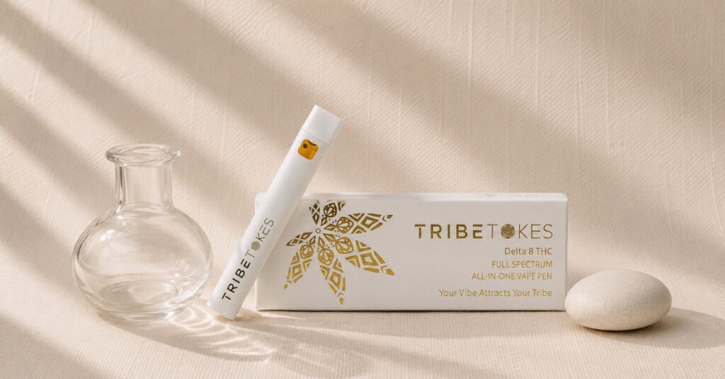 TribeTokes vape cartridge with clear glass vessel on cream linen — editorial flatlay representing residual solvent testing, extraction purity and hemp safety standards explained